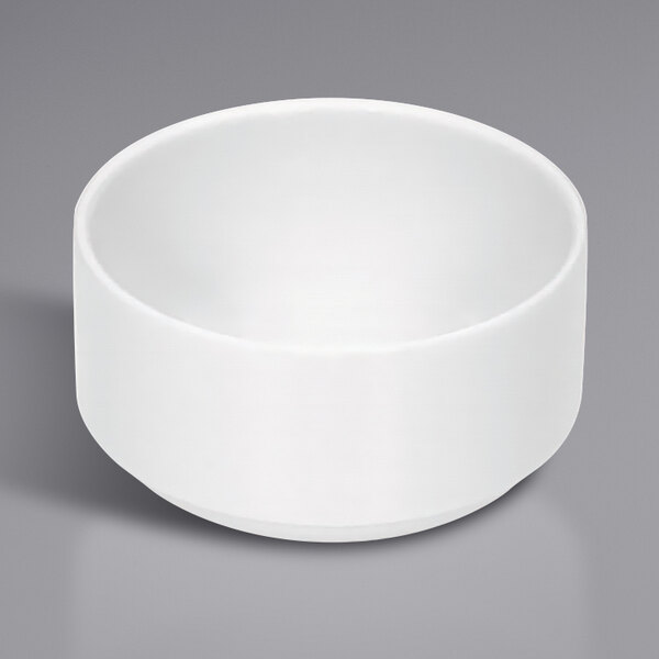 A Bauscher bright white porcelain cream soup bowl on a gray background.