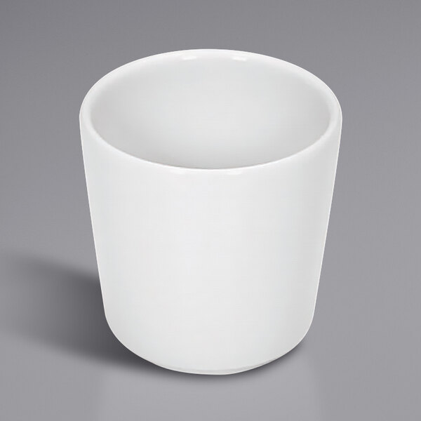 A Bauscher bright white porcelain cup on a gray background.