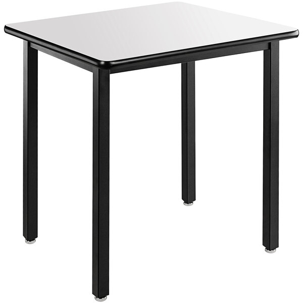 A white square table with black legs.