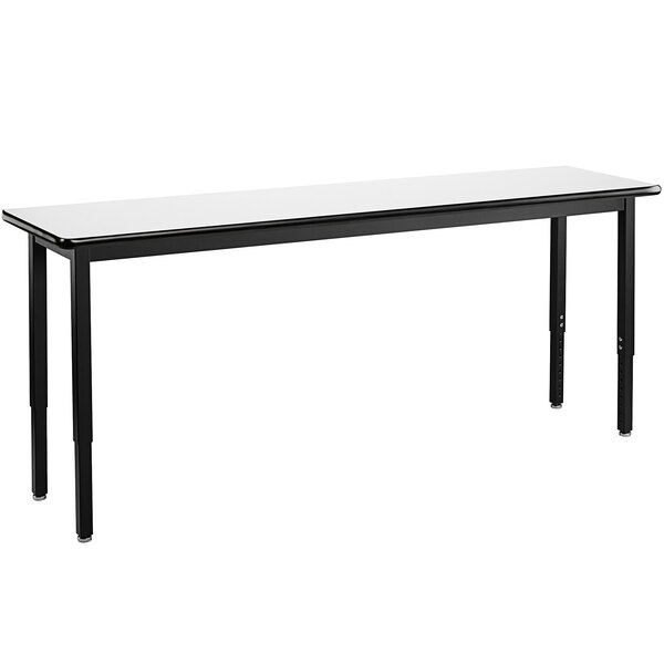 A long black National Public Seating utility table with a whiteboard top.