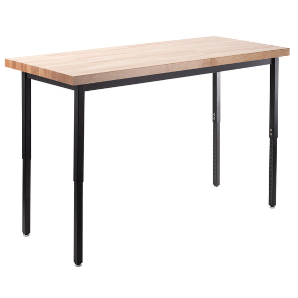 A National Public Seating seminar table with black legs and a maple butcher block top.