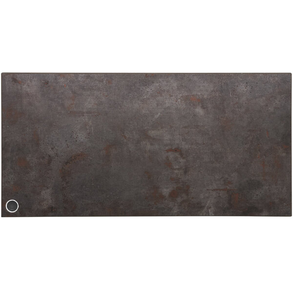 A BFM Seating rectangular metal table top with a rustic copper finish and a wireless charger circle.