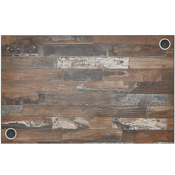 A planked pine rectangular table top with a wood surface and holes.
