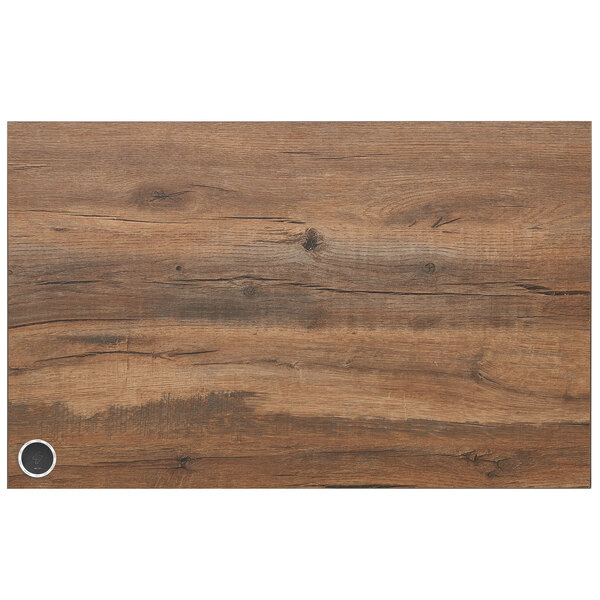 A BFM Seating knotty pine rectangular table top with a wood grained surface and a wireless charger hole.