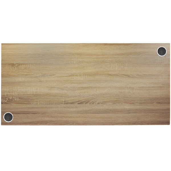 A BFM Seating Sawmill Oak rectangular wood tabletop with metal screws.