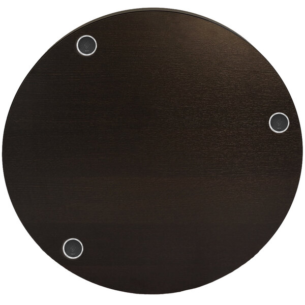 A round black BFM Seating Midtown table with silver screws in it.