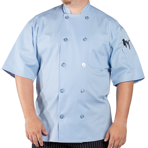 A man wearing a Uncommon Chef sky blue short sleeve chef coat.