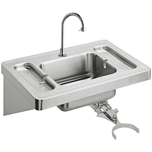 A stainless steel Elkay wall hung lavatory sink with knee control and faucet.