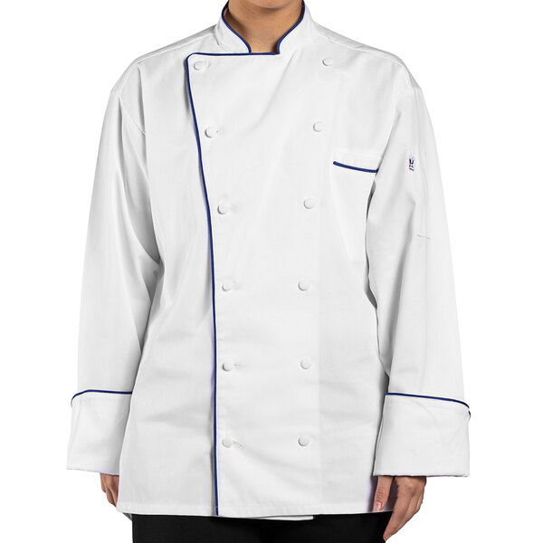 A person wearing a Uncommon Chef white chef coat with blue piping.