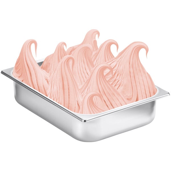 A metal tray with Fabbri Pink Grapefruit frozen dessert mix with a pink swirl on top.