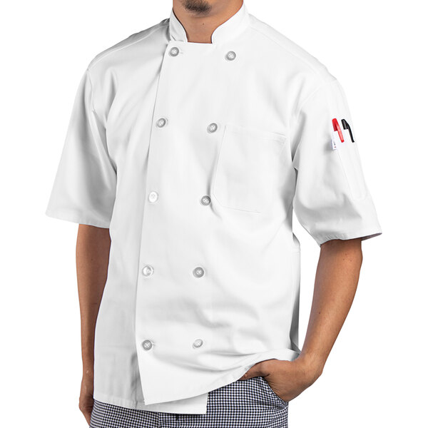 A man wearing a white Uncommon Chef Montego Pro Vent chef coat.
