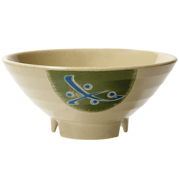 A white melamine bowl with a blue and green Japanese design on it.