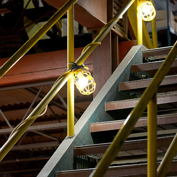 Yellow Lind Equipment LED string lights on a railing.