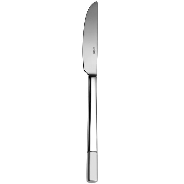 A Sola stainless steel dessert knife with a white handle and silver end.