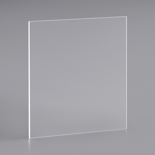 A clear glass panel on a gray surface with a white rectangular frame.