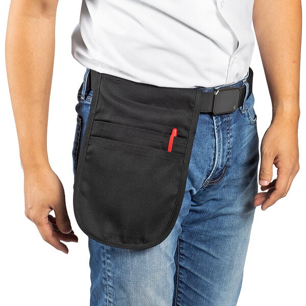 A man wearing a black Uncommon Chef utility pouch apron with red pockets.
