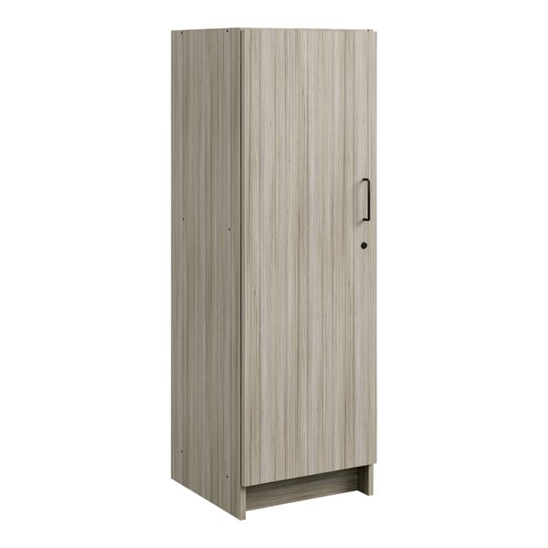 A wooden Tot Mate tall cabinet with a door and black handles.