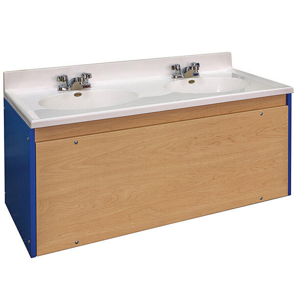 A Tot Mate blue and maple double laminate floor vanity with white sinks.