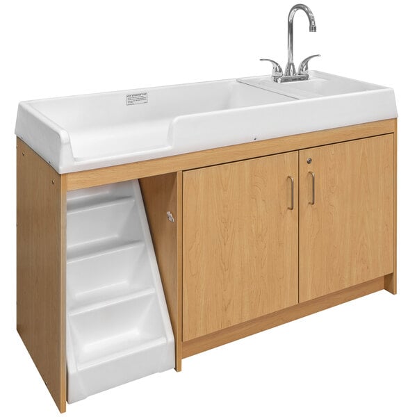 A maple toddler changing table with a sink on the right.