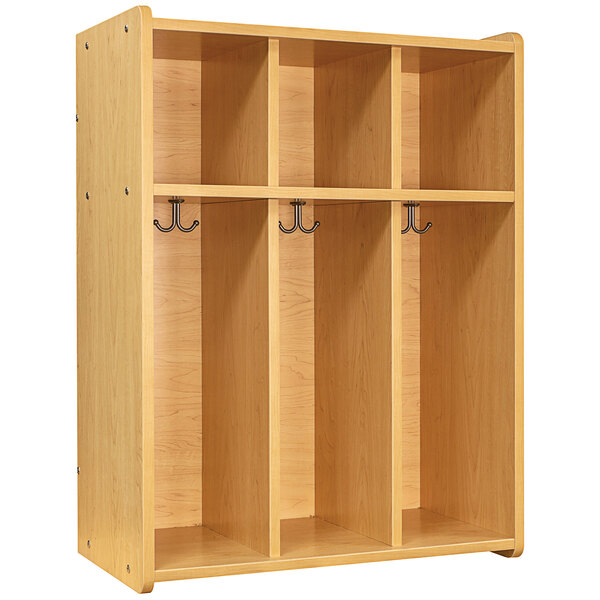 A Tot Mate maple laminate locker with three shelves and hooks.