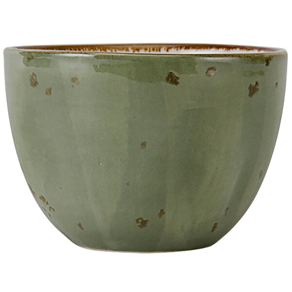 A green Tuxton china bouillon cup with brown specks.