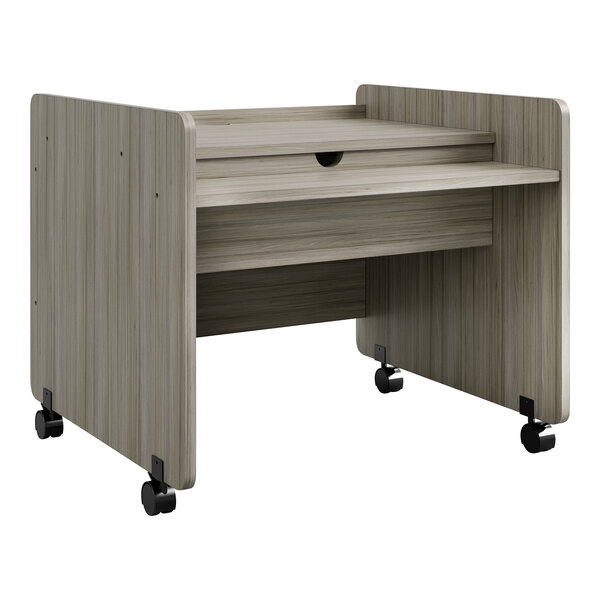 A Tot Mate Shadow Elm laminate mobile desk with wheels.