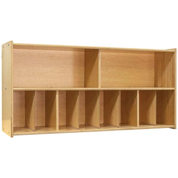 A Tot Mate natural birch plywood diaper wall storage with four compartments.