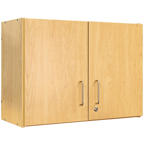 A maple wooden Tot Mate 2-level wall cabinet with silver handles.