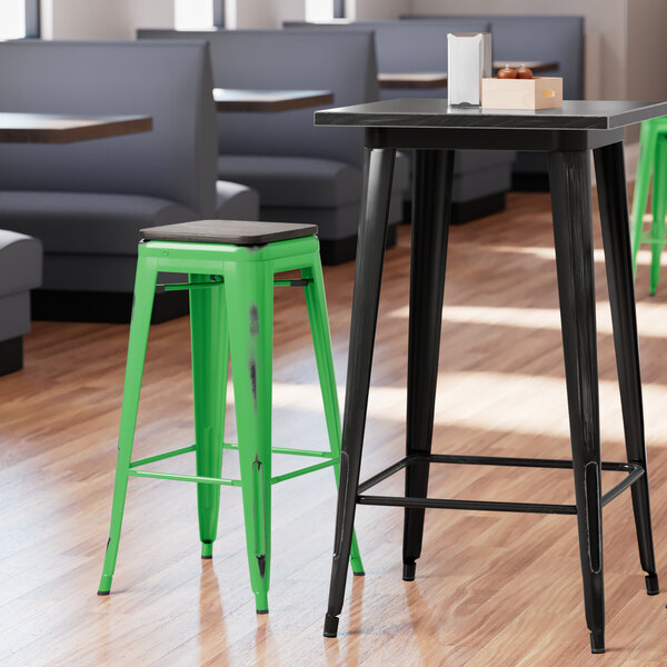 Lancaster Table & Seating Alloy Series Distressed Green Stackable Metal Indoor Industrial Barstool with Black Wood Seat
