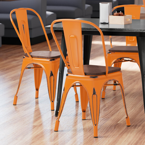 Lancaster Table & Seating Alloy Series Distressed Orange Metal Indoor Industrial Cafe Chair with Vertical Slat Back and Walnut Wood Seat