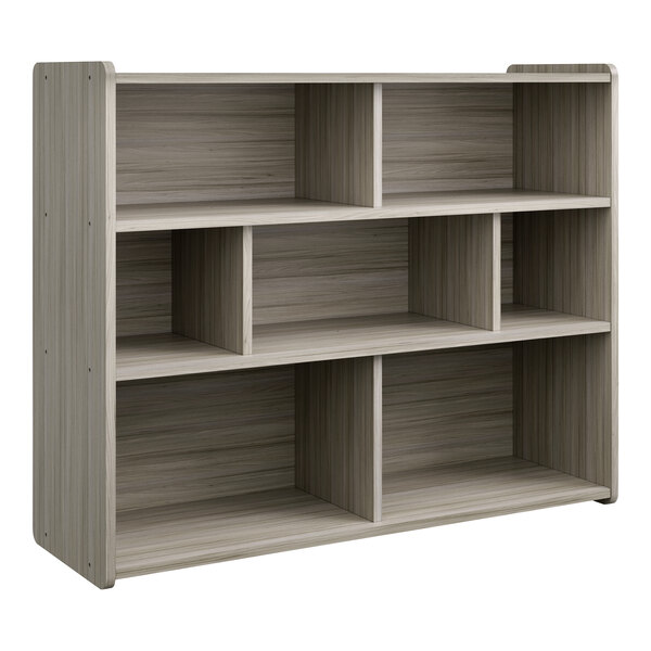 A Tot Mate Shadow Elm laminate storage unit with shelves inside.