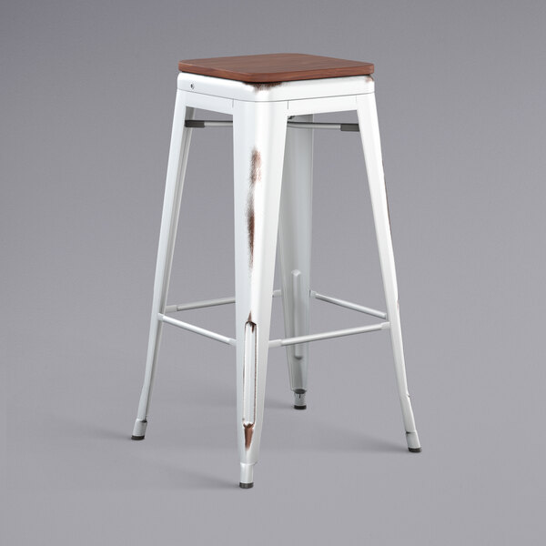 Lancaster Table & Seating Alloy Series Distressed White Stackable Metal Indoor Industrial Barstool with Walnut Wood Seat