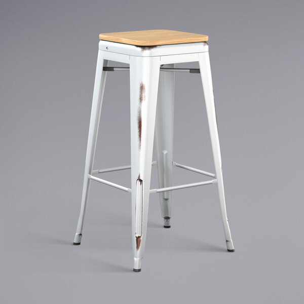 Lancaster Table & Seating Alloy Series Distressed White Stackable Metal Indoor Industrial Barstool with Natural Wood Seat
