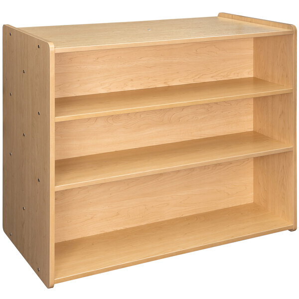 A wooden Tot Mate school age storage shelf with shelves on it.