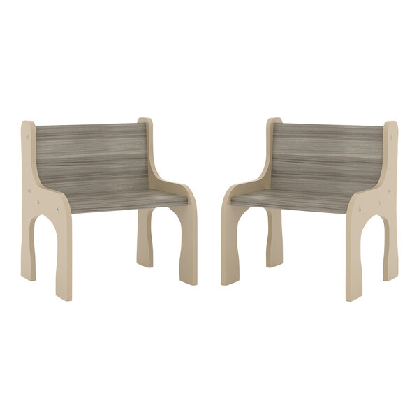 A pair of Tot Mate Shadow Elm laminate activity chairs with legs.