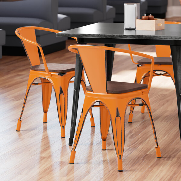 Lancaster Table & Seating Alloy Series Distressed Orange Metal Indoor Industrial Cafe Arm Chair with Vertical Slat Back and Walnut Wood Seat
