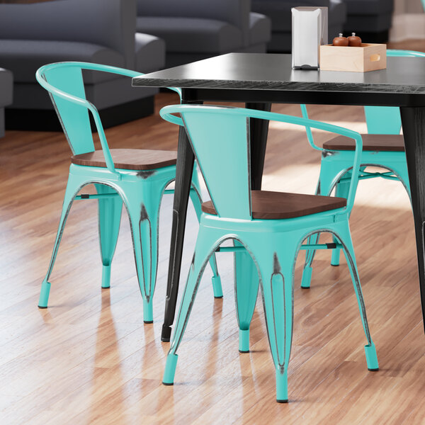 Lancaster Table & Seating Alloy Series Distressed Seafoam Metal Indoor Industrial Cafe Arm Chair with Vertical Slat Back and Walnut Wood Seat