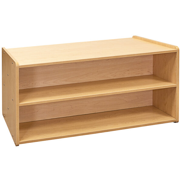 A Tot Mate maple laminate toddler double sided storage shelf with shelves.