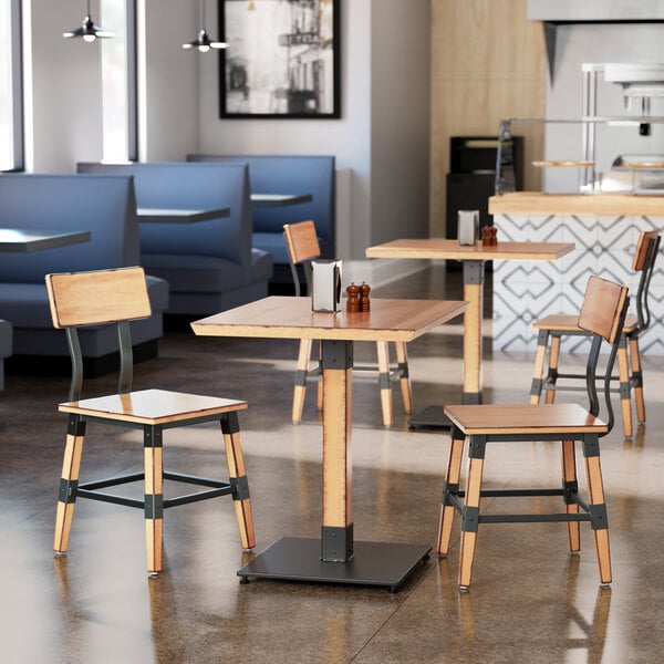 A Lancaster Table & Seating live edge wood table with chairs in a restaurant.