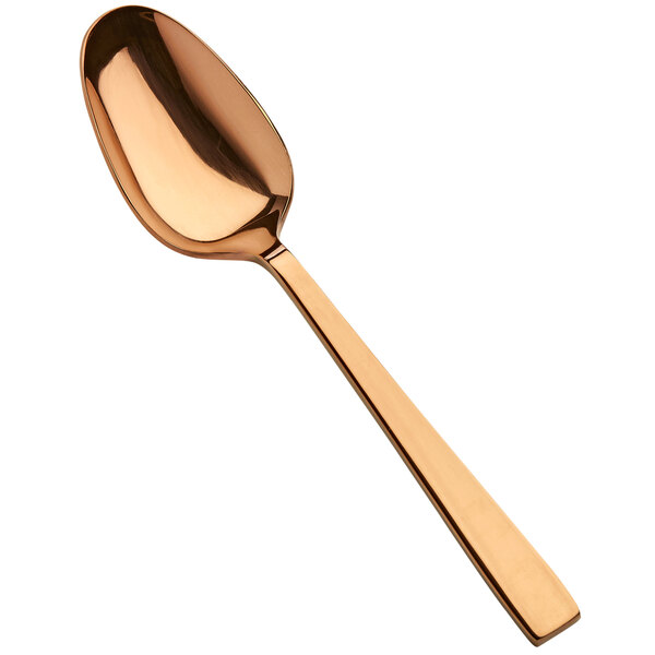 A Bon Chef stainless steel serving spoon with a rose gold handle.