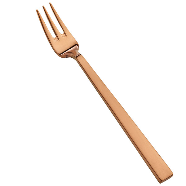 A close up of a Bon Chef rose gold oyster/cocktail fork.
