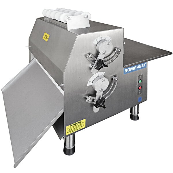 A Somerset countertop dough sheeter with a stainless steel top and lid open.