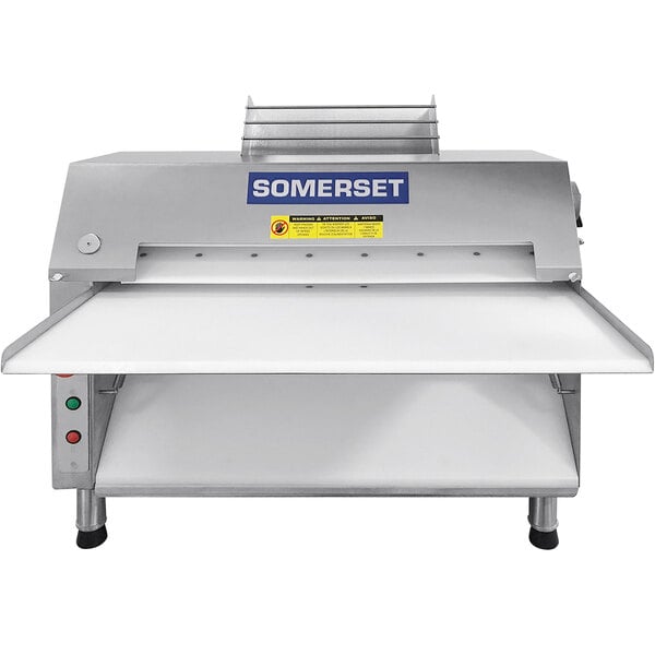 A Somerset CDR-2500 dough sheeter with a white cover.