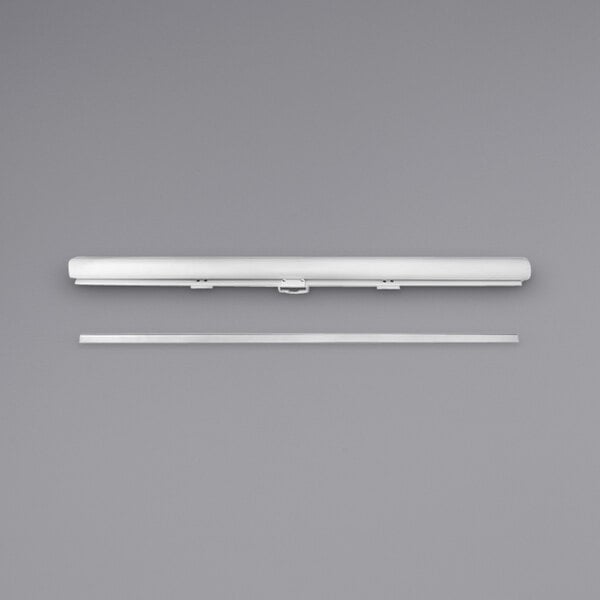 A white object with a long strip: Turbo Air night curtain for TOM-50L/S air curtain merchandisers.
