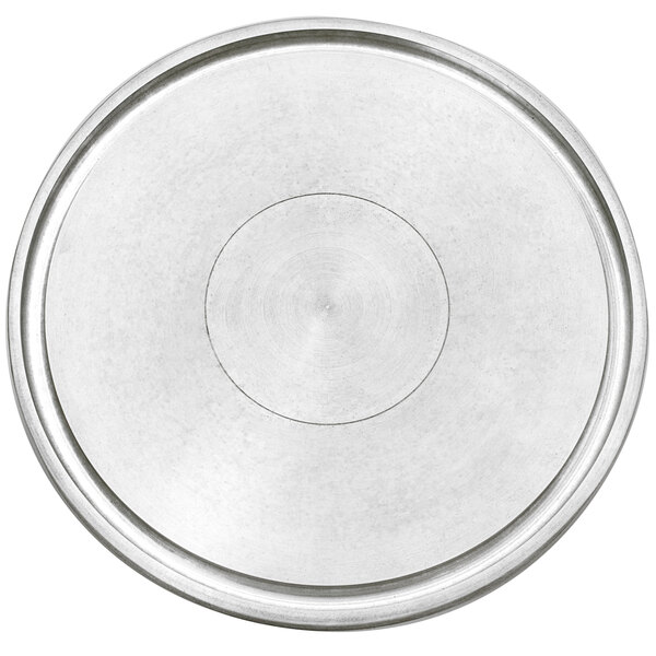 A silver metal circular plate with a black circular line around the edge.