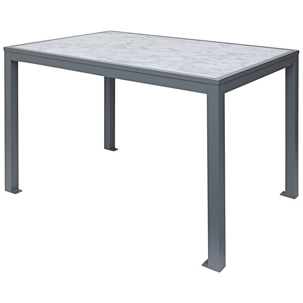 A BFM Seating standard height table with a white frame and a Carrara marble top.