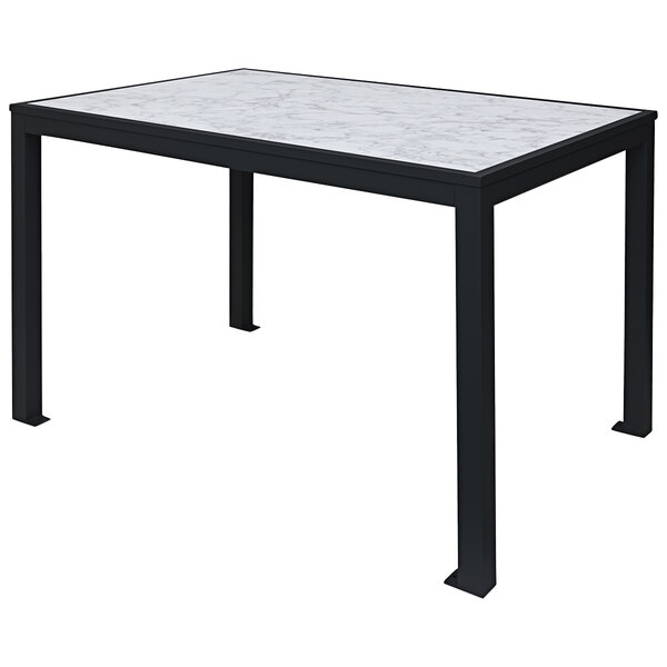 A BFM Seating standard height outdoor table with a black and white marble top and black legs.