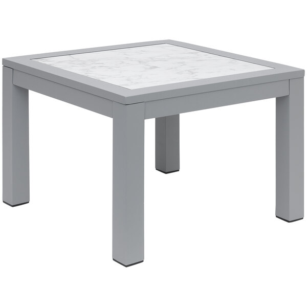 A soft grey aluminum end table with a Carrara marble top.