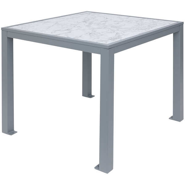 A white table with a soft gray aluminum frame and a marble top.