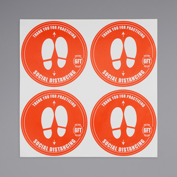 An American Metalcraft pack of 40 orange social distancing floor decals with footprints and text.